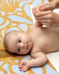 Massage of baby hand at home in the morning